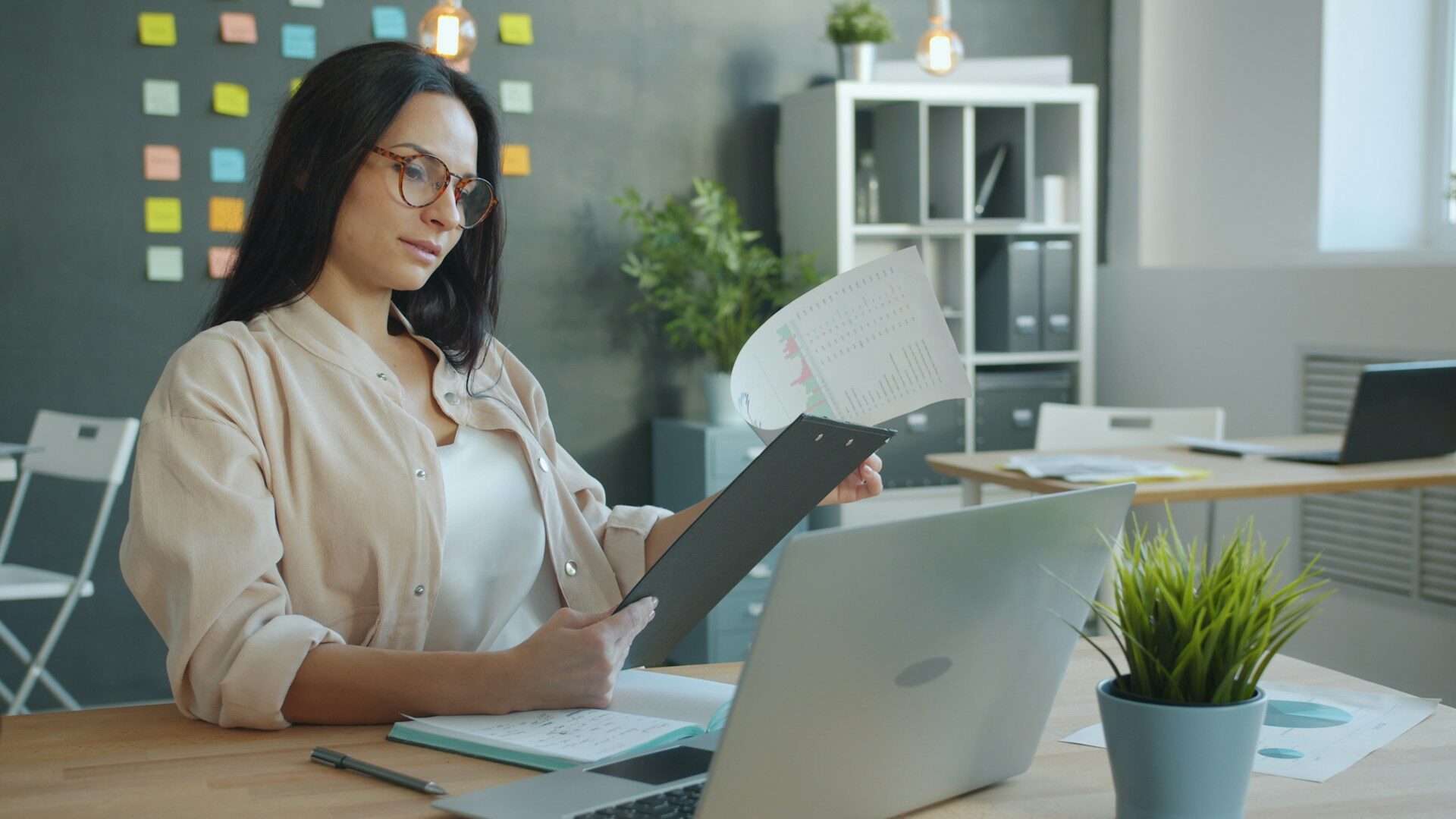 Learn how to read agency financial reports so you can understand your numbers, spot cash flow problems, review profitability, and make better decisions for your agency. Woman working with documents at office desk