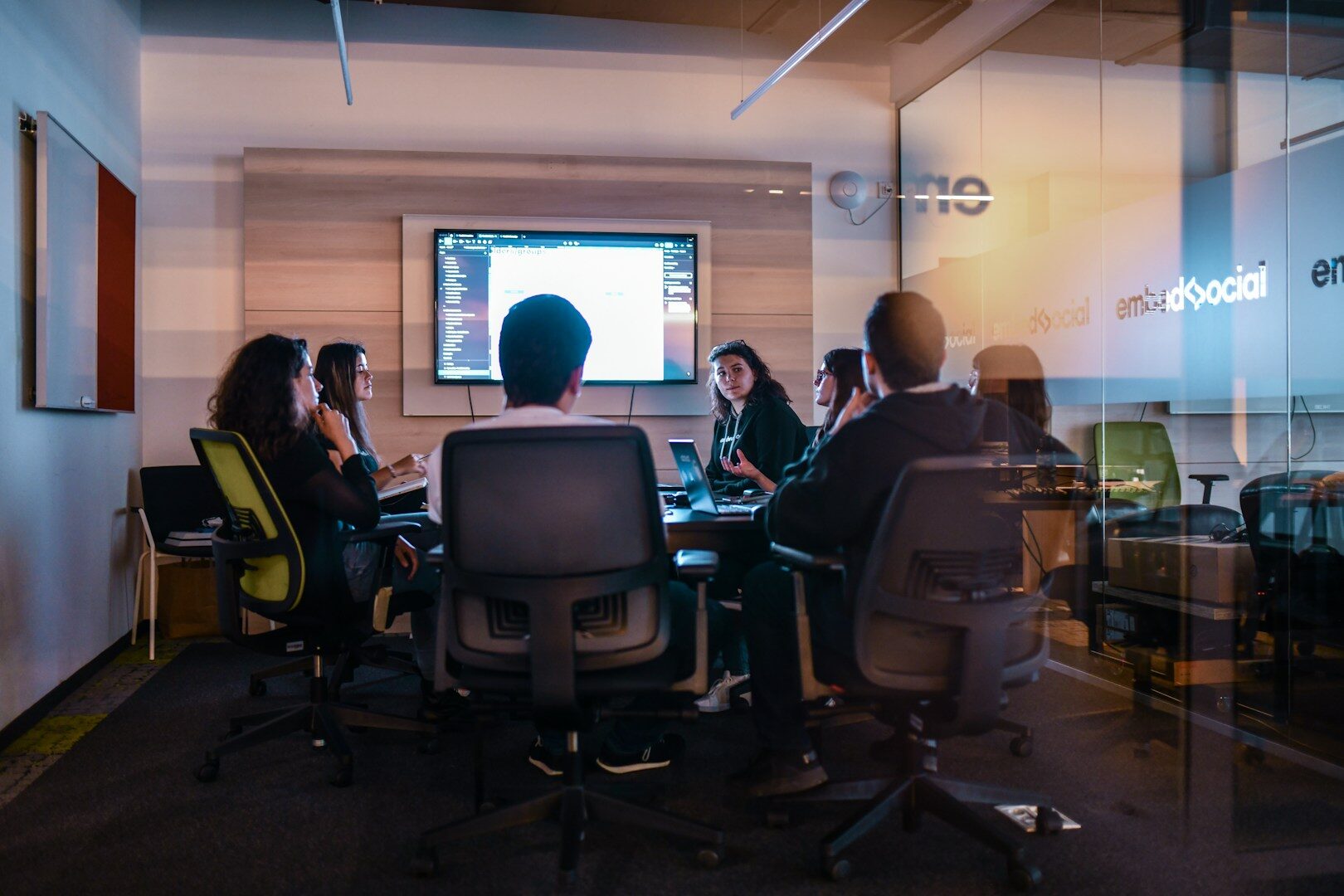 Is your marketing agency growing but your bank account is empty? Discover the systemic operational traps causing agency cash flow problems and how to solve them permanently.. a group of people sitting in chairs in front of a projector screen